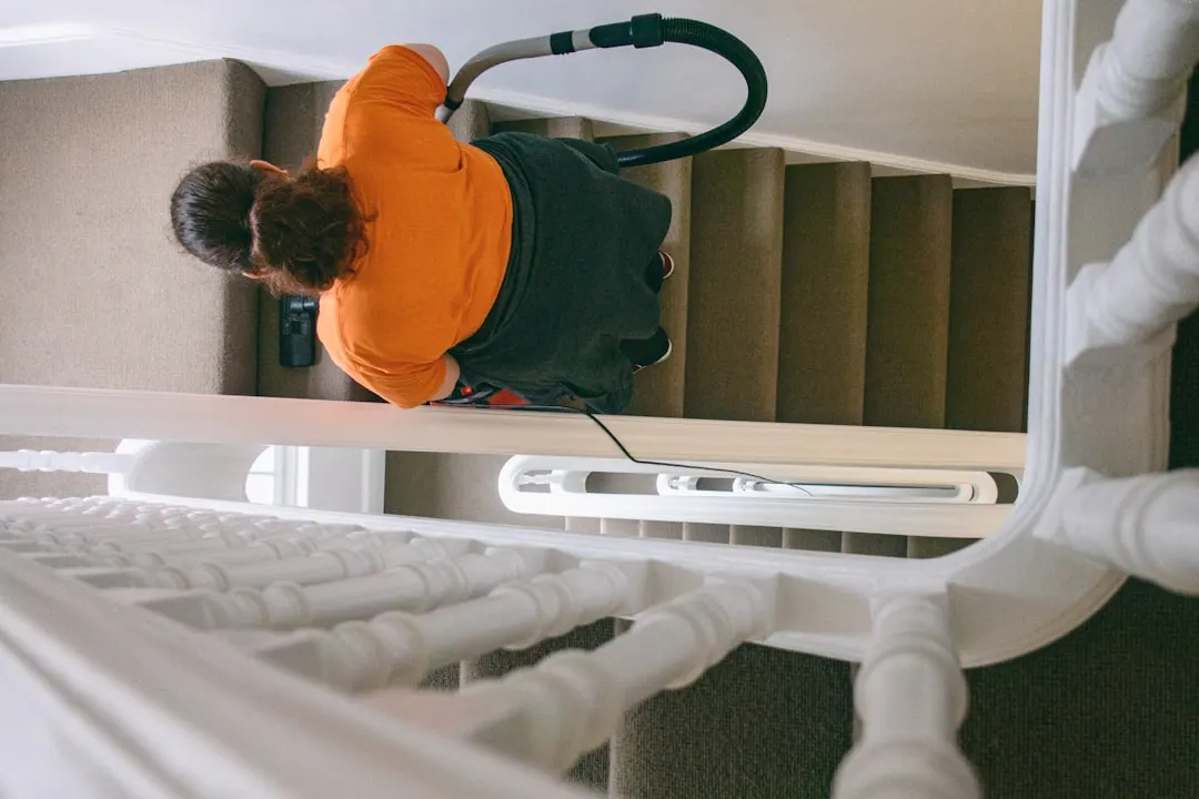 Duct cleaning technician with HEPA vacuum in Edmonton