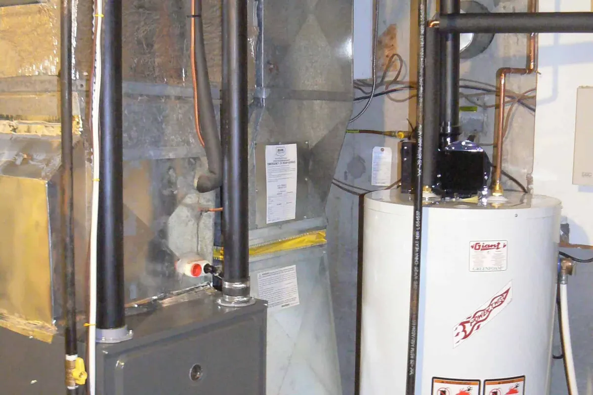 New high-efficiency gas furnace installed in a Edmonton basement mechanical room