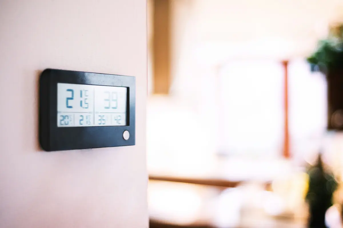 Modern smart thermostat on a residential wall in Edmonton